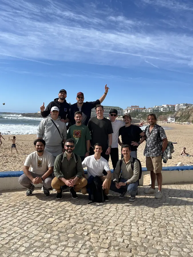 Group photo on the beach, waving